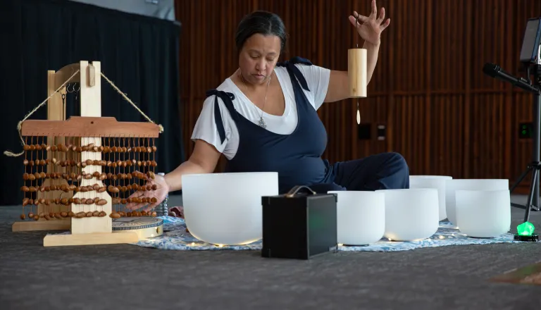 Woman performing sound bath