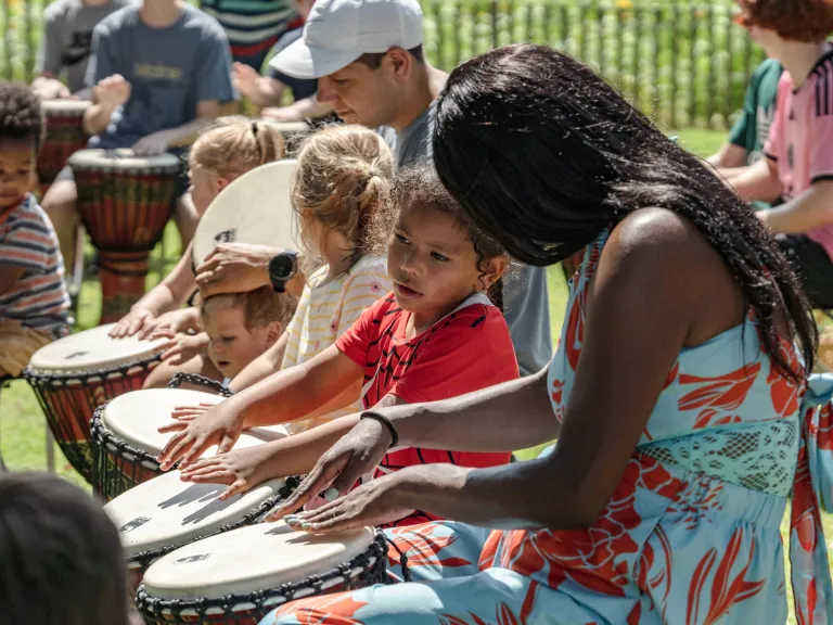 kids and adults drumming